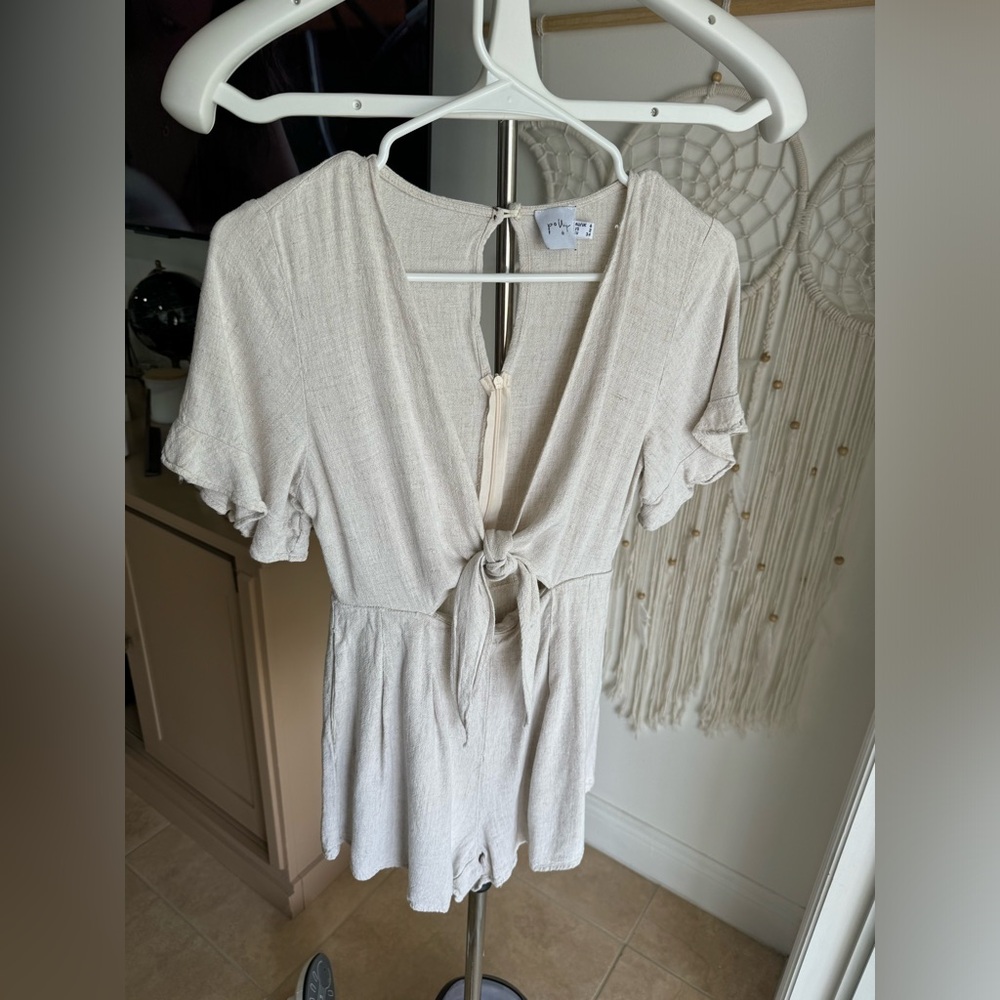 Light beige ruffled front tie romper